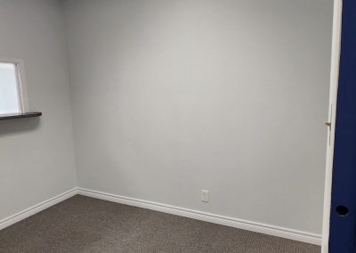 Unfurnished small office with neutral walls and carpet in Burlington Office Centre professional building.