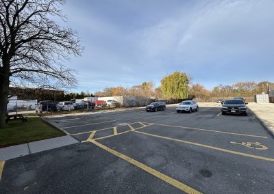 Surface parking lot in front of Burlington Office Centre small office building in Burlington ON.